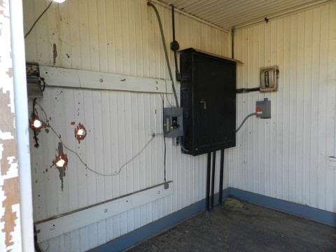 The inside of the forward power shed, I could find no trace of the generator footings but the black power distribution box is still original and on the wall. Perhaps they got power from the local town of Arlington, which had a power generator at the time in the 1930s.