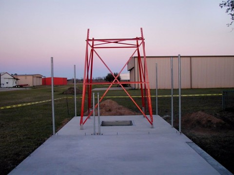 Freshly painted, the bottom section is placed in position on 5 Feb 2013