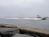 If it hadn't been raining, I would've stayed longer to watch the boats in the inlet.