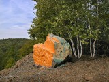 View of the orange-yellow boulder at south end of rock pile butte.