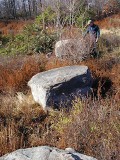 Looking W toward the mark while standing on the eastmost boulder. Rich indicates the general location of the disk.