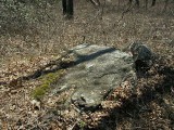 Eye-level view of the mark on the outcropping.