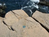 HOLE is a nice example of a topographic station disk high on an outcrop above the sea ...
