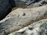 Eyelevel view of the disk set in the outcropping rock.