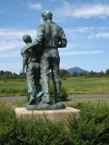 Looking N; Whiteface Mountain in the background. John Brown appears to be leading the slave boy to freedom and safety in the North.