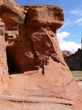 This disk can be found at the south entrance to a small tunnel carved through the brilliant red rock of the canyon.