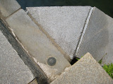 Eyelevel view of the benchmark disk set into the wingwall of the Little Harbor Brook bridge.