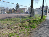 Looking SSE: view of mark, Penn Street, and basketball courts in the park.