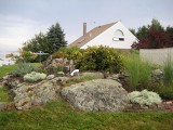The rock garden as seen from the small parking area adjacent to the road and cottage.