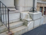 Eyelevel view of the chiseled cross on the step