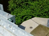 Eyelevel view of the disk on the wingwall of the new bridge.
