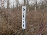 Signpost (bridge number?) at the site