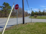 Proximity of monument to pole, stop sign and intersection