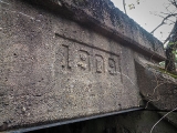 1909 is stamped into the northwestern side of the concrete culvert.